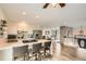 Open concept kitchen with modern countertops, stainless steel appliances and an eat-in breakfast bar at 2176 S Welch Cir, Lakewood, CO 80228