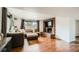 Finished basement featuring a comfortable sectional, brick fireplace and large windows at 2176 S Welch Cir, Lakewood, CO 80228