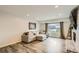 Comfortable living area with recessed lighting, sofa, and brick fireplace at 2176 S Welch Cir, Lakewood, CO 80228