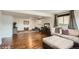 Spacious finished basement with hardwood floors and a comfortable sectional sofa at 2176 S Welch Cir, Lakewood, CO 80228