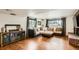Finished basement featuring a comfortable sectional, hardwood floors and an entertainment center at 2176 S Welch Cir, Lakewood, CO 80228