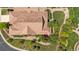 Aerial view of the property highlighting the roof, landscaping, and surrounding neighborhood at 671 Hiddenbrook Ct, Littleton, CO 80126