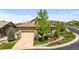Charming home with a stone facade, tile roof, and well-manicured front yard at 671 Hiddenbrook Ct, Littleton, CO 80126