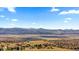 Scenic view showcasing the landscape, mountains, and vast open land at 671 Hiddenbrook Ct, Littleton, CO 80126