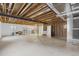 Large unfinished basement with exposed ceiling, offering potential for customization at 671 Hiddenbrook Ct, Littleton, CO 80126