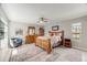 Bright bedroom with wood bed frame, wooden furniture, and hardwood floors at 2757 E Geddes Ave, Centennial, CO 80122
