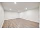 Clean and empty bedroom with laminated wood floors and neutral paint at 2757 E Geddes Ave, Centennial, CO 80122