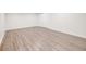 Clean and empty bedroom with laminated wood floors and neutral paint at 2757 E Geddes Ave, Centennial, CO 80122