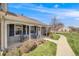 Single story home featuring a covered porch, walkway, and mature landscaping at 2757 E Geddes Ave, Centennial, CO 80122
