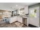 Clean kitchen with stainless steel appliances, granite countertops, and tile backsplash at 2757 E Geddes Ave, Centennial, CO 80122