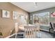 The Kitchen offers stainless appliances, granite countertops and abundant storage in white cabinets at 2757 E Geddes Ave, Centennial, CO 80122