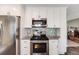 The kitchen features stainless appliances, granite countertops, and updated backsplash at 2757 E Geddes Ave, Centennial, CO 80122
