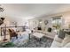 Bright living room boasts hardwood floors, lots of natural light, and stylish decor at 2757 E Geddes Ave, Centennial, CO 80122