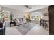 Bright living room with a large window, hardwood floors, and comfortable seating area at 2757 E Geddes Ave, Centennial, CO 80122