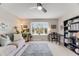 Open living room with hardwood floors, area rug, and large windows showcasing the outdoor view at 2757 E Geddes Ave, Centennial, CO 80122