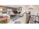 Open-concept living room with fireplace, neutral decor, and hardwood floors at 2757 E Geddes Ave, Centennial, CO 80122