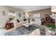 Comfortable living room featuring two sofas, neutral tones, and light wood floors at 2757 E Geddes Ave, Centennial, CO 80122