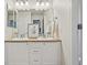 Bright bathroom featuring double sinks and large mirror at 17032 Blue Mist Grv, Monument, CO 80132