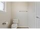 Toilet area featuring elongated toilet and towel bar at 17032 Blue Mist Grv, Monument, CO 80132