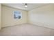 Empty bedroom with beige carpet, a window, and ceiling fan at 17032 Blue Mist Grv, Monument, CO 80132