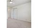 Spacious bedroom featuring neutral carpet, ceiling fan and closet doors at 17032 Blue Mist Grv, Monument, CO 80132