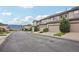 A peaceful neighborhood street with garage parking, landscaping, and mountain views at 17032 Blue Mist Grv, Monument, CO 80132