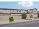 A row of garages showcasing ample parking and complemented by green landscaping at 17032 Blue Mist Grv, Monument, CO 80132