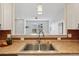 A view of the kitchen sink with stainless steel fixtures and light pendant at 17032 Blue Mist Grv, Monument, CO 80132
