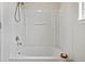 All white bathtub and shower combination at 17032 Blue Mist Grv, Monument, CO 80132