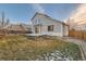 House with deck and grassy backyard, perfect for outdoor living at 303 Tumbleweed Dr, Brighton, CO 80601