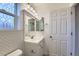 Bright bathroom with white vanity, subway tile, and updated fixtures at 303 Tumbleweed Dr, Brighton, CO 80601