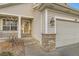 House exterior showcasing front entrance and stone accents at 303 Tumbleweed Dr, Brighton, CO 80601