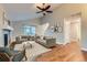 Spacious living room featuring hardwood floors, fireplace, and neutral color palette at 303 Tumbleweed Dr, Brighton, CO 80601