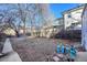 Large backyard with mature trees and a partially fenced area at 2339 S Adams St, Denver, CO 80210