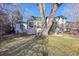 Large backyard with mature trees and wooden fence at 2339 S Adams St, Denver, CO 80210