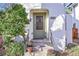 Inviting front door entry with a screen door and potted plants at 2339 S Adams St, Denver, CO 80210