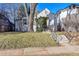 House's exterior with a tree and stairs leading to the front door at 2339 S Adams St, Denver, CO 80210