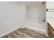 Bathroom features a tub and a sink with a wood vanity at 17652 E Temple Dr, Aurora, CO 80015