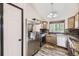 Kitchen featuring stainless steel appliances, mosaic tile backsplash, and granite countertops at 17652 E Temple Dr, Aurora, CO 80015