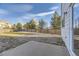 Well-maintained backyard with a concrete patio and a wood fence, perfect for outdoor enjoyment at 254 Ellendale St, Castle Rock, CO 80104