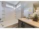 Bathroom showcases a bathtub, tiled shower, vanity with sink, and natural light from above windows at 254 Ellendale St, Castle Rock, CO 80104