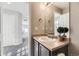 Bathroom offers a vanity sink, a large mirror, and serene decor, enhancing the room's appeal at 254 Ellendale St, Castle Rock, CO 80104