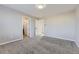 A carpeted bedroom offers a view of a bathroom, ensuring comfort and convenience at 254 Ellendale St, Castle Rock, CO 80104