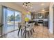 Charming eat-in kitchen with stainless steel appliances, gray cabinets and a sliding glass door to the yard at 254 Ellendale St, Castle Rock, CO 80104