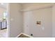 Laundry room with tile flooring, utility connections and a metal storage shelf at 254 Ellendale St, Castle Rock, CO 80104