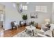 Bright living room with vaulted ceilings, hardwood floors, leading to the staircase at 254 Ellendale St, Castle Rock, CO 80104