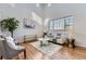 Bright living room with vaulted ceilings, hardwood floors, and a large window that fills the space with natural light at 254 Ellendale St, Castle Rock, CO 80104