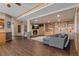 Open basement with a fireplace, built-in shelves, and a comfortable gray couch at 5699 Northwood Dr, Evergreen, CO 80439