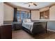 Bedroom with wood-look flooring, a sled bed, and a bright window view at 5699 Northwood Dr, Evergreen, CO 80439