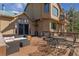 Outdoor deck featuring patio furniture and an exterior view of the home at 5699 Northwood Dr, Evergreen, CO 80439